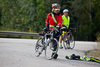 two cyclists stopped at side of road