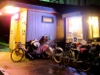 bicycles in front of iluminated storefront