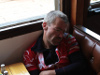 Man sleeping in restaurant booth